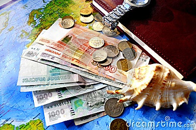 The photo shows a composition consisting of banknotes, money, coins, a notebook. Editorial Stock Photo