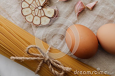 Photo of sliced garlic beside pasta Stock Photo