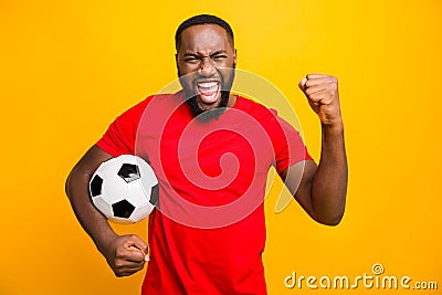 Photo of soccer team trendy african black funny captain wearing red t-shirt holding soccer ball prepared to win local Stock Photo