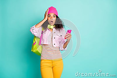 Photo of speechless shocked stunned crazy girl having received feedback from her followers on social media wearing cap Stock Photo