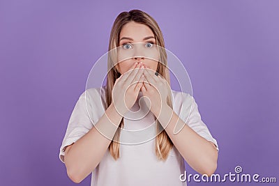 Photo of speechless voiceless lady hands cover mouth wear casual t-shirt on violet background Stock Photo