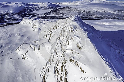 Drone photo of Atoklimpen Atoklinten mountain around Hemavan, Tarnaby villages, Lappland, Northern Sweden. Sunny day, cold blue Stock Photo