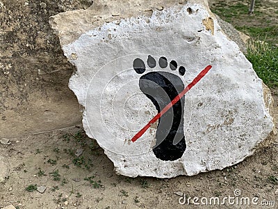 Photo of stone with don`t touch sign, Gobustan Azerbaijan Stock Photo