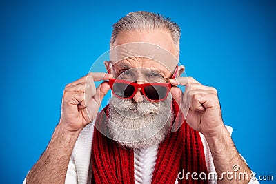 Photo of sweet doubtful mature man dressed white pullover arms red glasses isolated blue color background Stock Photo