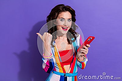 Photo of sweet excited girl dressed striped overall texting instagram twitter telegram facebook thumb empty space Stock Photo