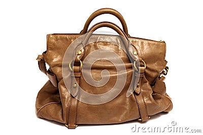 A brown luxury ladies bag with hand hold straps Stock Photo