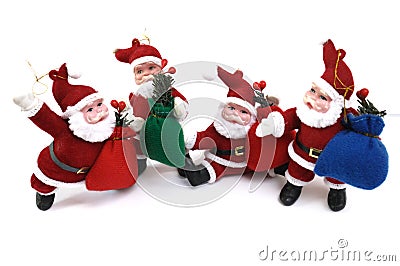 Santa Claus Father Christmas Figurines closeup on display white backdrop Stock Photo