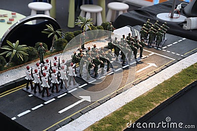 Miniature figurines toys of soldiers in formal parade uniforms marching with rifles Stock Photo
