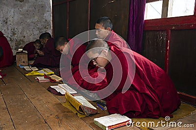 Bhutanese novice monks learn the Buddhism text in early morning , Bhutan Editorial Stock Photo