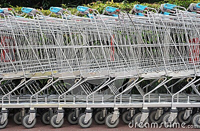 A row of shopping trolleys Stock Photo