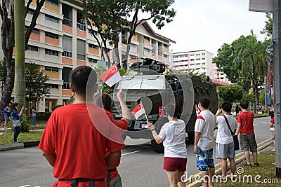 A Singapore military army anti riot peace keeping vehicle driving past the heartlands at Jurong West Avenue 5 during the nation`s Editorial Stock Photo