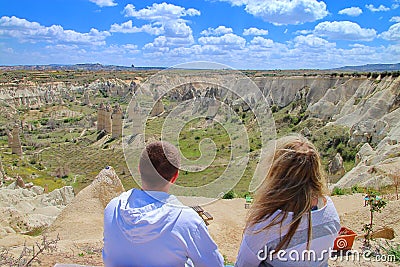 Young couple admiring the scenery of the mountains of Cappadocia Editorial Stock Photo