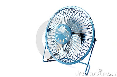 A universal serial bus powered blue portable table fan placed at one side Stock Photo