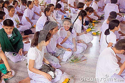 Thai students wear white clothes making a merit at the temple in Pranburi, Thailand July 21,2017 Editorial Stock Photo