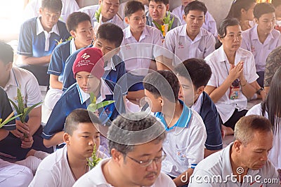 Thai students wear white clothes making a merit at the temple in Pranburi, Thailand July 21,2017 Editorial Stock Photo
