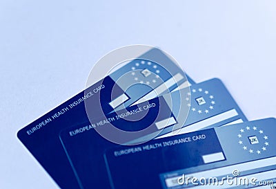 Photo of three European Health Insurance Cards. The EHIC Card from the NHS covers you against illness or injury when abroad Editorial Stock Photo