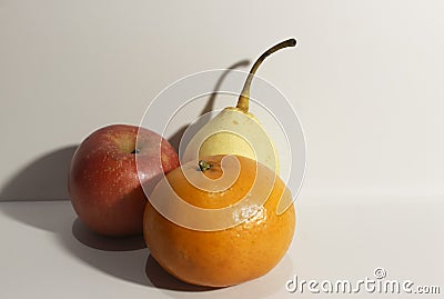 Photo of three kinds of fruit consisting of orange apple and pear Stock Photo