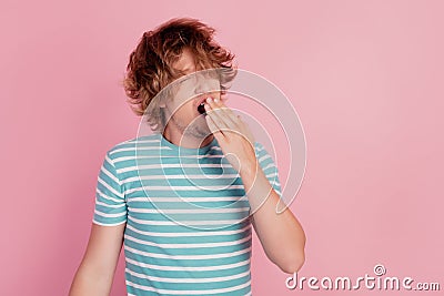 Photo of tired man yawn open mouth close hand wear casual blue striped t-shirt on pink background Stock Photo