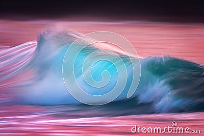 Photo of turquoise wave at sunset Stock Photo