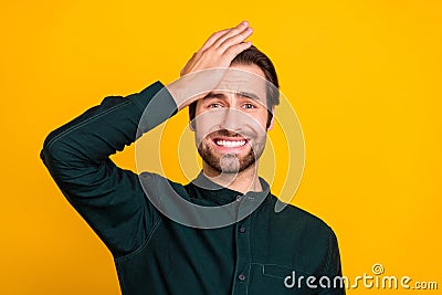 Photo of unhappy depressed young man wear smart casual outfit forget important thing arm forehead yellow color Stock Photo