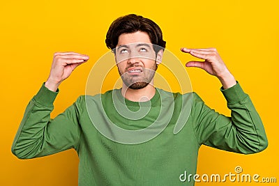 Photo of unhappy upset bored man hold hands speak conversation people isolated on yellow color background Stock Photo