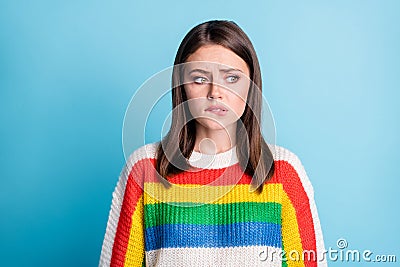 Photo of unsatisfied young lady biting lips look empty space thinking isolated on blue color background Stock Photo