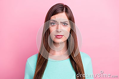 Photo of unsure pretty young lady wear teal t-shirt looking you isolated pink color background Stock Photo