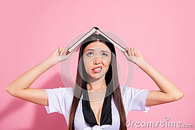 Photo of upset lady hold book above head hiding from rain drops oh no wear specs white top red skirt isolated pink Stock Photo