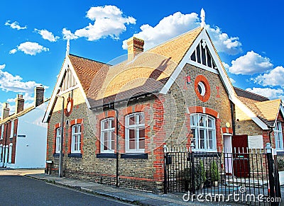 Victorian building architecture home house era bricks school yard gates town city village Editorial Stock Photo