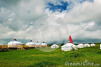 The white mongolia yurts on the green steppe Stock Photo
