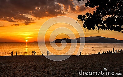 Seascape with Colorful Clouds, Orange Sky and The Sun at Sunrise in Nha Trang Stock Photo