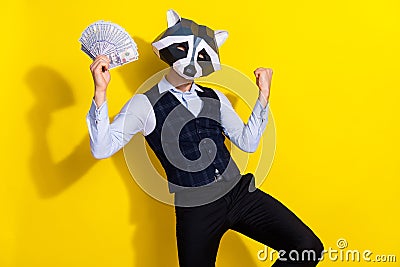 Photo of weird freak guy hold billion cashback luck win raise fists up wear trend theme costume isolated over yellow Stock Photo