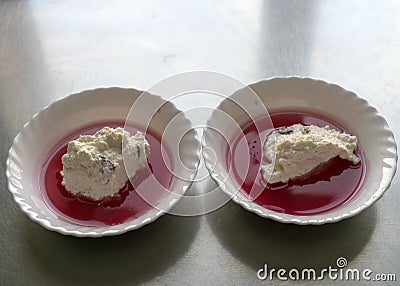 White bowl, cranberry jelly with cottage cheese cream, school feeding concept, lunch for students Stock Photo