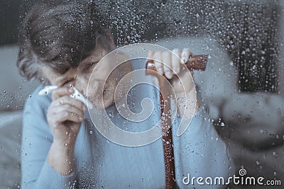Lonely senior woman crying Stock Photo