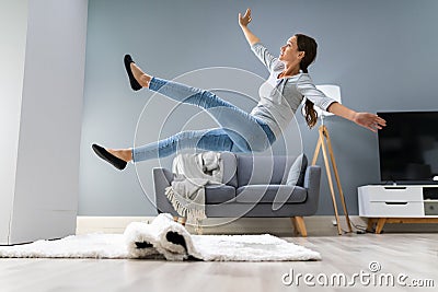 Woman Legs Stumbling With A Carpet Stock Photo