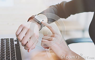 Photo Woman Working Modern loft,Using Generic Design Smart Watch.Female Finger Touching Screen Smartwatch.Account Manage Stock Photo