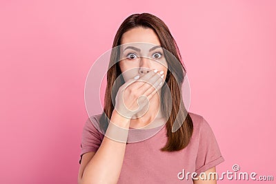 Photo of worried brunette young lady close mouth wear t-shirt isolated on pink color background Stock Photo