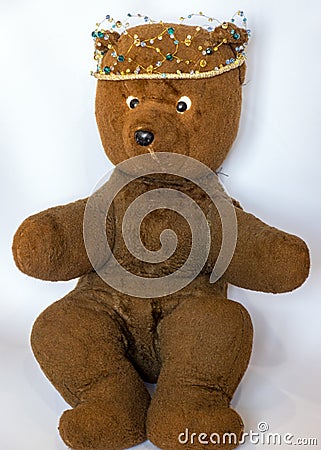 Photo of a 45-year-old bear with a homemade pearl crown on his head,handmade Stock Photo