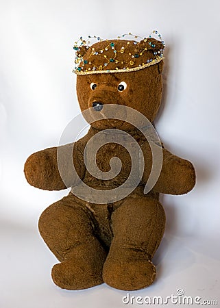 Photo of a 45-year-old bear with a homemade pearl crown on his head,handmade Stock Photo