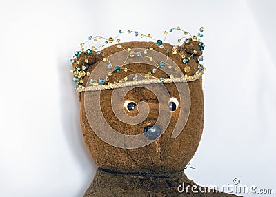 Photo of a 45-year-old bear with a homemade pearl crown on his head,handmade Stock Photo