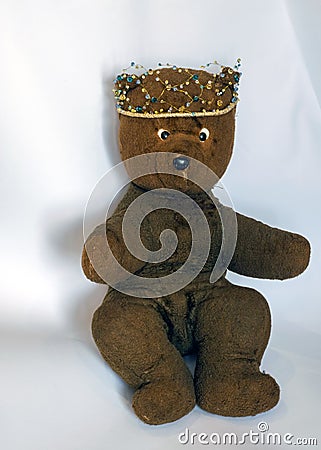 Photo of a 45-year-old bear with a homemade pearl crown on his head,handmade Stock Photo