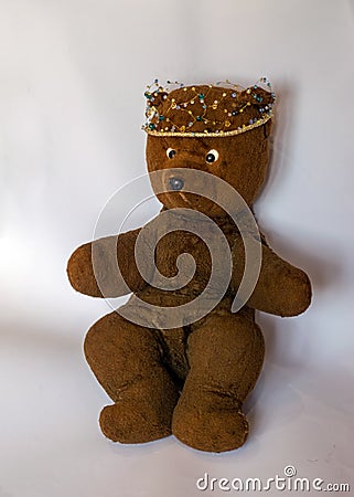 Photo of a 45-year-old bear with a homemade pearl crown on his head,handmade Stock Photo