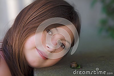 Portrait of a Girl and a Snail Stock Photo