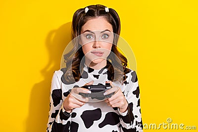 Photo of young addicted girl bite lips losing hard level wear trendy cow skin print shirt hold gamepad isolated on Stock Photo