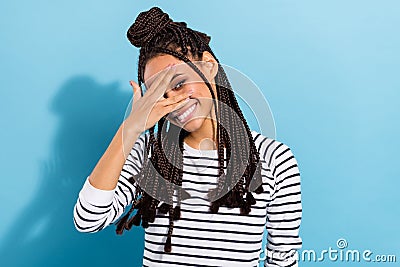 Photo of young african girl happy positive smile close fingers eye funky isolated over blue color background Stock Photo