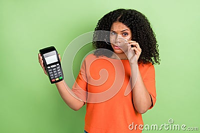 Photo of young african woman payment cashless paypass transaction isolated over green color background Stock Photo