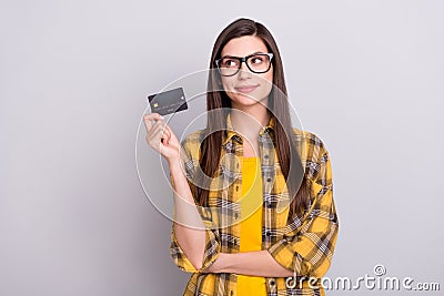 Photo of young attractive woman happy positive smile pay shop debit card isolated over grey color background Editorial Stock Photo