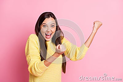 Photo of young beautiful excited crazy amazed ecstatic woman hold fists up scream isolated on pink color background Stock Photo