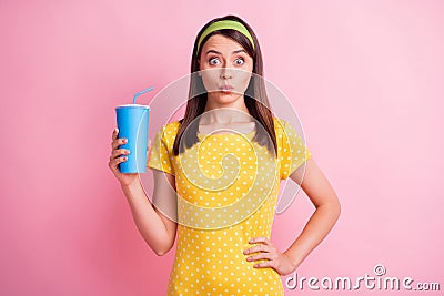 Photo of young beautiful shocked amazed surprised girl pout lips hold cola soda isolated on pink color background Stock Photo