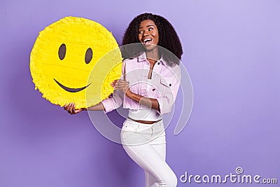 Photo of young beautiful stunning positive lovely african girl show yellow emoticon isolated on purple color background Stock Photo